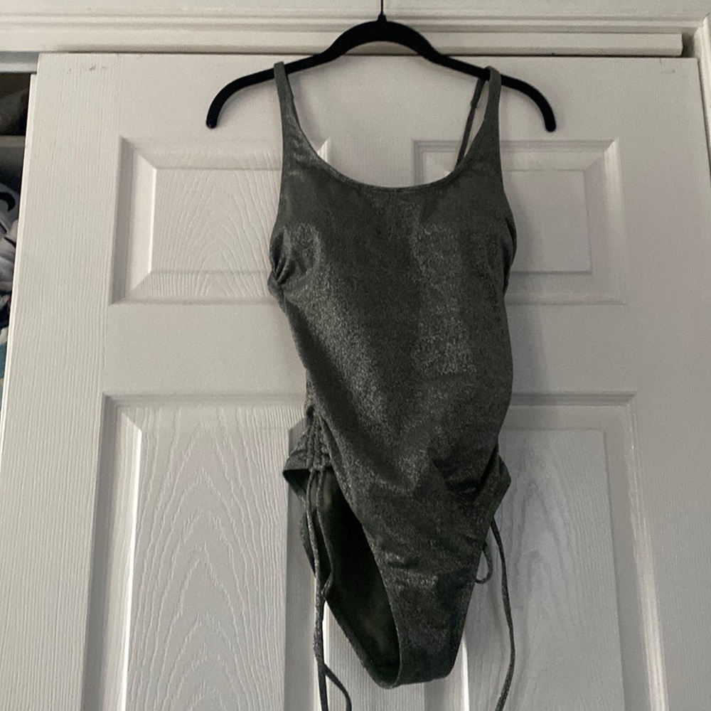 A green sparkly bathing suit